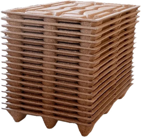 A tall stack of nested pressed-wood rackable pallets.